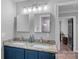 Bathroom featuring double sinks, granite countertops, updated fixtures, and ample storage at 116 Ivy Hollow Ln, Mooresville, NC 28117
