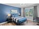 Inviting bedroom with a blue color scheme, a comfortable bed, and a window offering natural light at 116 Ivy Hollow Ln, Mooresville, NC 28117