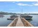 Two docks connected with several boats along the water with blue skies in the background at 116 Ivy Hollow Ln, Mooresville, NC 28117