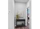 Cozy hallway with a console table, decorative plant, and artwork, leading to a bedroom at 116 Ivy Hollow Ln, Mooresville, NC 28117