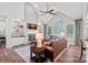 Bright living room features a fireplace, built-in shelves, vaulted ceilings, and large windows at 116 Ivy Hollow Ln, Mooresville, NC 28117