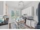 Bright office features built-in storage, a modern light fixture, and lots of natural light at 116 Ivy Hollow Ln, Mooresville, NC 28117