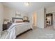 Bedroom featuring queen bed, dresser, and ensuite bath at 1178 Arges River Dr, Fort Mill, SC 29715