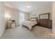 Bedroom featuring a queen bed, neutral paint and carpet at 1178 Arges River Dr, Fort Mill, SC 29715