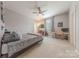 Bedroom featuring a ceiling fan, TV, workspace, and neutral carpet at 1178 Arges River Dr, Fort Mill, SC 29715