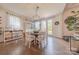 Elegant dining room with a round table, stylish lighting, and access to the outdoors at 1178 Arges River Dr, Fort Mill, SC 29715