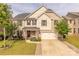 Charming two-story brick home featuring a well-manicured lawn and inviting front porch perfect for relaxation at 1178 Arges River Dr, Fort Mill, SC 29715