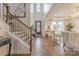 Elegant foyer featuring a staircase, hardwood floors, and access to a bright, airy living space at 1178 Arges River Dr, Fort Mill, SC 29715
