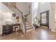 Inviting foyer with hardwood floors, staircase, and stylish decor creating a warm and welcoming entrance at 1178 Arges River Dr, Fort Mill, SC 29715