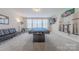 Inviting game room boasts a sleek pool table, lounge seating, and entertainment setup for leisure and fun at 1178 Arges River Dr, Fort Mill, SC 29715