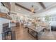 Expansive living room featuring hardwood floors, a fireplace, and a modern open concept design with exposed wood beams at 1178 Arges River Dr, Fort Mill, SC 29715
