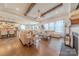 Spacious living room with hardwood floors, fireplace, modern lighting and open floor plan at 1178 Arges River Dr, Fort Mill, SC 29715