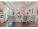 Bright and stylish home office with large windows, comfortable seating, and chic decor at 1178 Arges River Dr, Fort Mill, SC 29715
