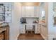 Charming office nook with built-in cabinets, marble countertop, and decorative wallpaper at 1178 Arges River Dr, Fort Mill, SC 29715