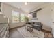 Cozy sitting room with neutral tones, a comfortable sofa, and a bright window at 1178 Arges River Dr, Fort Mill, SC 29715