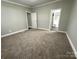 Comfortable bedroom with plush carpeting and neutral walls, creating a serene and inviting space at 121 C & K Dr # 60, Taylorsville, NC 28681