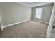 Neutral bedroom with wall to wall carpet and a window for natural light at 121 C & K Dr # 60, Taylorsville, NC 28681