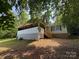 Exterior home featuring stairs to a porch, set against a backdrop of trees at 121 C & K Dr # 60, Taylorsville, NC 28681