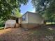 Exterior home featuring stairs to a porch, set against a backdrop of trees at 121 C & K Dr # 60, Taylorsville, NC 28681