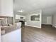 Open-concept kitchen featuring granite countertops, stainless steel appliances, and vinyl flooring at 121 C & K Dr # 60, Taylorsville, NC 28681