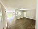 Open living area with vinyl floors and a view into the modern kitchen, creating a welcoming atmosphere at 121 C & K Dr # 60, Taylorsville, NC 28681