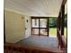 Cozy covered porch with wooden railings, perfect for relaxing and enjoying the outdoors at 121 C & K Dr # 60, Taylorsville, NC 28681