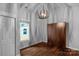 Cozy bedroom with hardwood floors, gray walls, and a unique light fixture at 1500 Pecan Ave, Charlotte, NC 28205