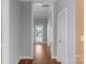 Hallway with hardwood floors leading to an exterior door at 1500 Pecan Ave, Charlotte, NC 28205
