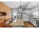 Open concept kitchen with island, stainless steel appliances, and desk area at 1500 Pecan Ave, Charlotte, NC 28205