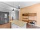 Bright kitchen features granite countertops, an island, pendant lighting, and built-in shelving at 1500 Pecan Ave, Charlotte, NC 28205