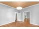 This living room features hardwood floors, neutral paint, and a modern pendant lamp at 1500 Pecan Ave, Charlotte, NC 28205