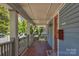 Inviting covered front porch featuring patterned tile flooring and white railing at 1500 Pecan Ave, Charlotte, NC 28205