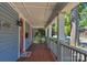 Charming covered front porch with patterned tile flooring and white railing at 1500 Pecan Ave, Charlotte, NC 28205