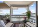 Relaxing balcony with views of the waterfront, complete with seating and potted plants at 17931 Kings Point Dr # E, Cornelius, NC 28031