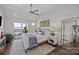Relaxing bedroom features hardwood flooring, balcony access with amazing views, and natural light at 17931 Kings Point Dr # E, Cornelius, NC 28031