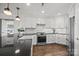 Modern kitchen features stainless steel appliances, sleek cabinetry, and ample counter space at 17931 Kings Point Dr # E, Cornelius, NC 28031