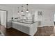 Bright kitchen boasts granite countertops, stainless steel appliances, and custom cabinetry at 17931 Kings Point Dr # E, Cornelius, NC 28031