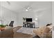 Relaxing living room featuring a comfortable futon, modern furnishings, and natural light at 17931 Kings Point Dr # E, Cornelius, NC 28031