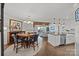 Open living space featuring a dining area and kitchen with bar seating and modern appliances at 17931 Kings Point Dr # E, Cornelius, NC 28031