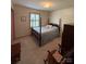 Charming bedroom featuring a four-poster bed, classic furnishings, and a serene ambiance at 200 Breslin St, Wadesboro, NC 28170