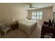 Inviting bedroom featuring a comfortable bed, natural light, and a ceiling fan for added comfort at 200 Breslin St, Wadesboro, NC 28170