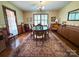 Charming dining room with hardwood floors, large rug, and classic decor at 200 Breslin St, Wadesboro, NC 28170