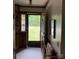 Inviting foyer with natural light streaming through the front door, showcasing a glimpse of the outdoors at 200 Breslin St, Wadesboro, NC 28170