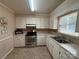 Functional kitchen with white cabinets, and stainless steel appliances at 200 Breslin St, Wadesboro, NC 28170
