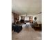 Spacious living room with brick fireplace, built-in shelving, and traditional furnishings at 200 Breslin St, Wadesboro, NC 28170