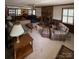 Cozy living room with a brick fireplace, plush seating, and carpet at 200 Breslin St, Wadesboro, NC 28170