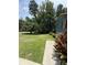 One-story home sits among green lawn and trees, with a large yard at 200 Breslin St, Wadesboro, NC 28170