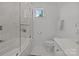 Bathroom showcasing marble-tiled shower-tub combo with glass screen at 2117 Middlebridge Ct, Fort Mill, SC 29715