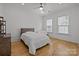 Bright bedroom with hardwood floors, neutral walls, and two windows at 2117 Middlebridge Ct, Fort Mill, SC 29715