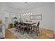 The spacious dining room offers a modern light fixture and a view to the outside at 2117 Middlebridge Ct, Fort Mill, SC 29715